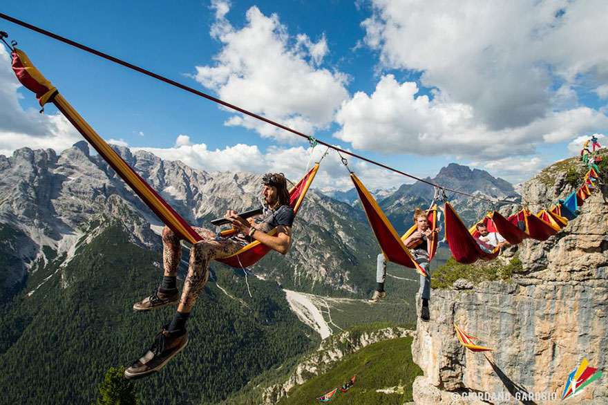 People At This Festival Slept On Hammocks Hanging Hundreds Of Feet Above The Italian Alps