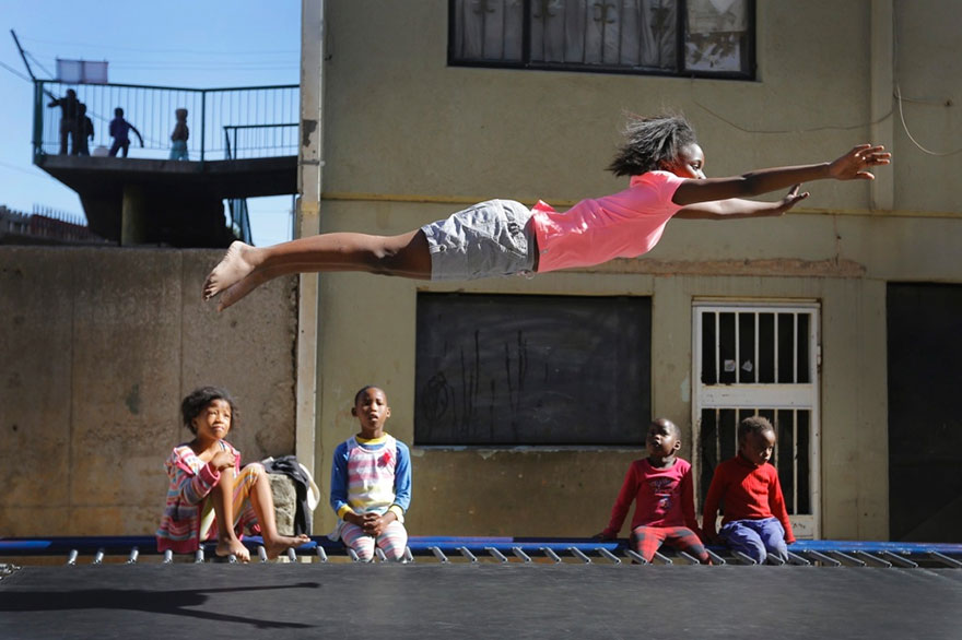 Kids From A Poor Part Of Johannesburg Receive A Trampoline And Soar Through The Air With Glee