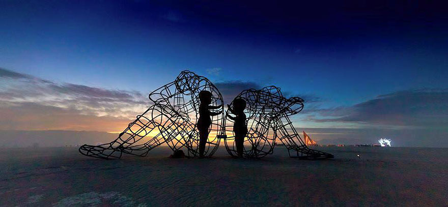 Powerful Sculpture At Burning Man Shows Inner Children Trapped Inside Adult Bodies