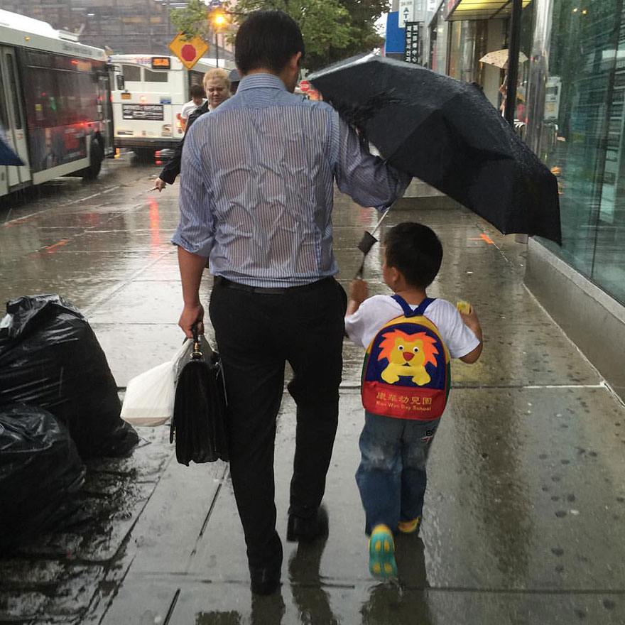 Soaked Dad Protecting His Schoolboy From Rain Shows What Parenting Is Soaked Dad Protecting His Schoolboy From Rain Shows What Parenting Is