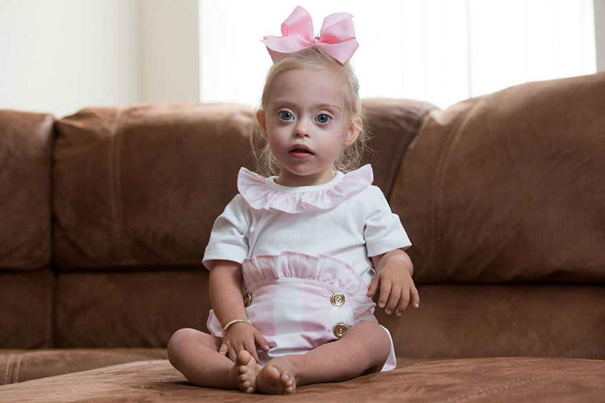 2-Year-Old Girl With Down Syndrome Wins Modeling Contract Thanks To Her Cheeky Smile 2-Year-Old Girl With Down Syndrome Wins Modeling Contract Thanks To Her Cheeky Smile