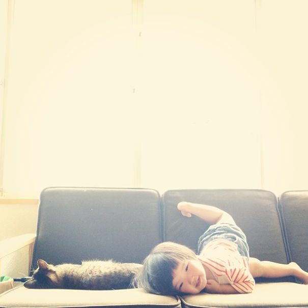 This Japanese Cat Is The Best Sleeping Buddy For His Baby Hoomins