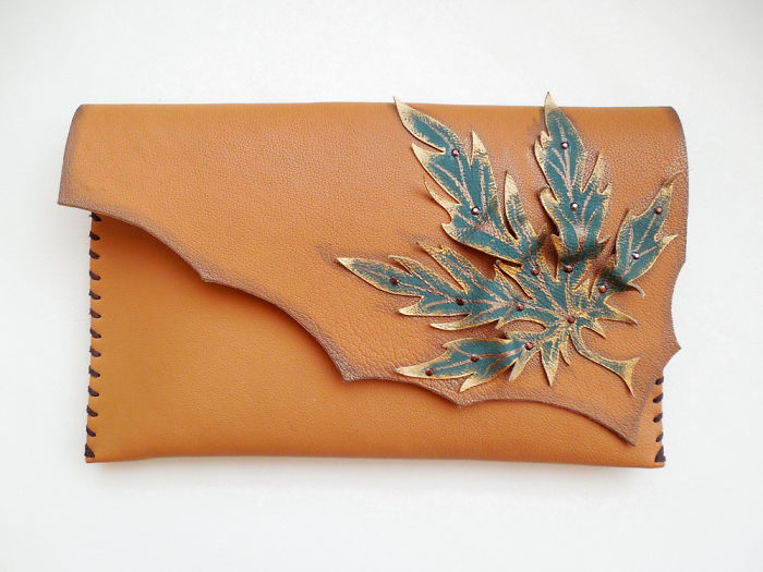 I Use Hand Cut Designs And 3D Collage Techniques To Create Unique Leather Bags