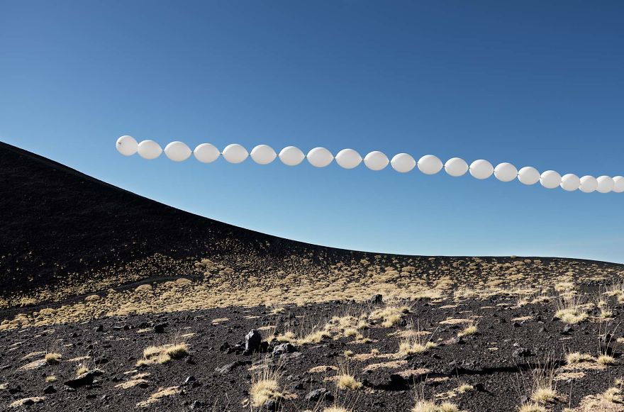 White Balloons Invade Various Places In Surreal Installations By Charles Pétillon