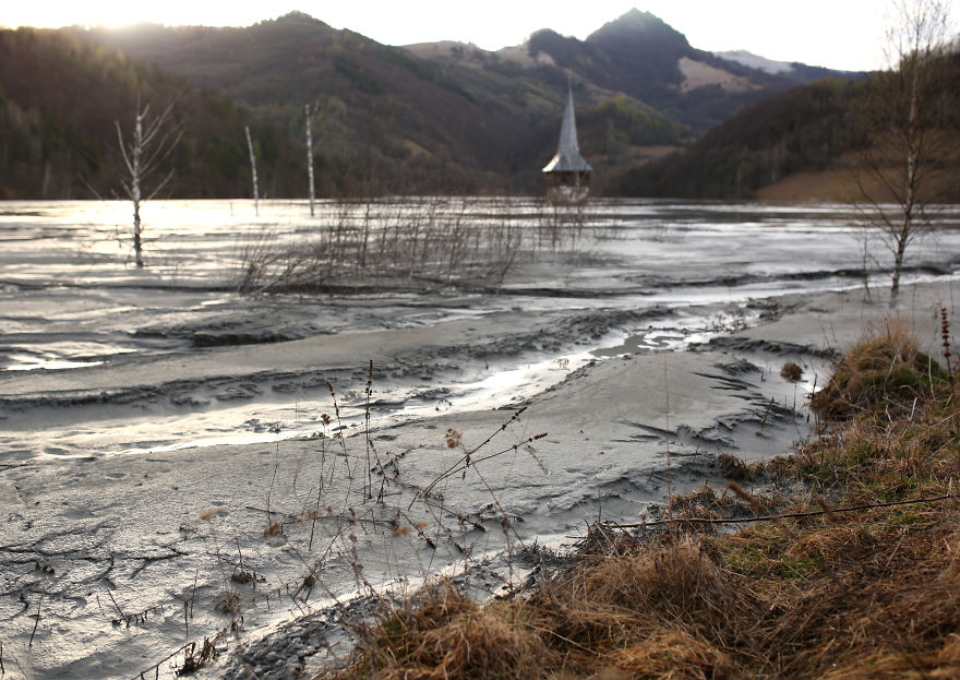 This Church Spire Is All That Remains Of A Village, Soon It Will Be Buried Completely