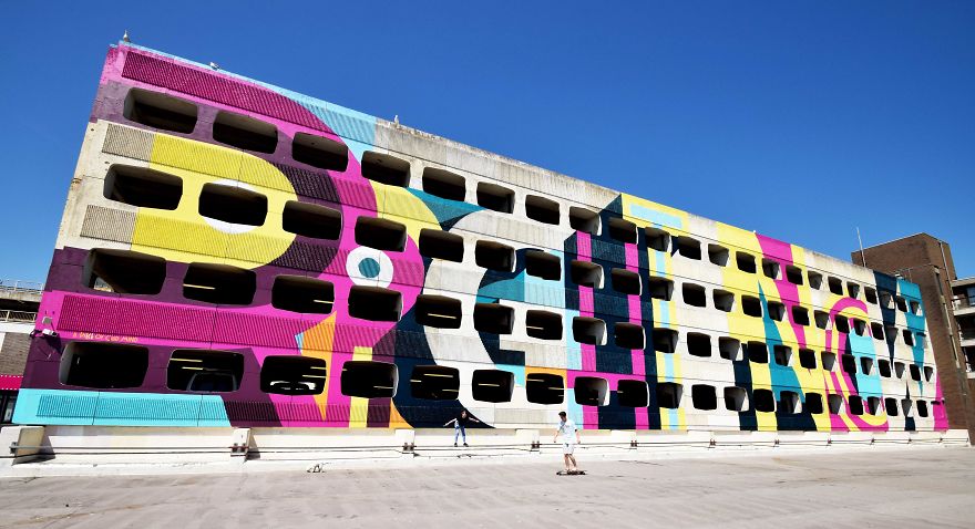 Street Artist Transforms 60s Carpark With Giant, Candy-Striped Supergraphic Artwork Street Artist Transforms 60s Carpark With Giant, Candy-Striped Supergraphic Artwork