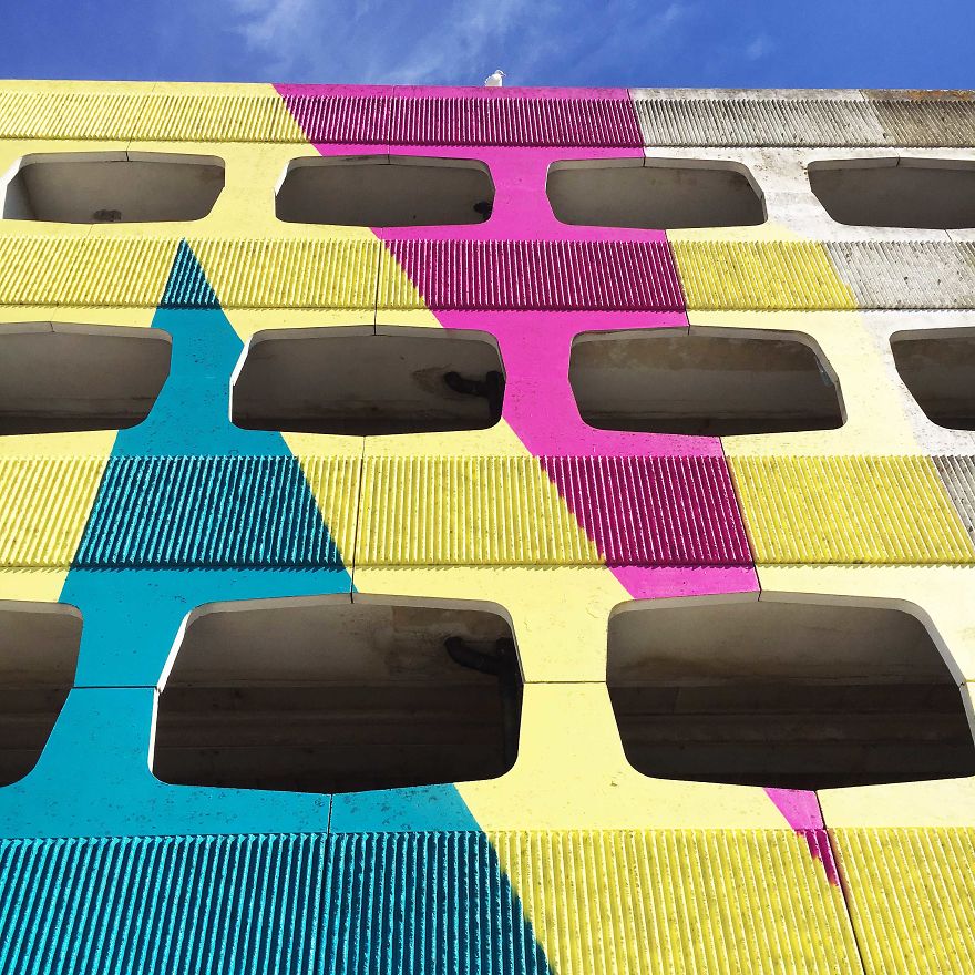 Street Artist Transforms 60s Carpark With Giant, Candy-Striped Supergraphic Artwork Street Artist Transforms 60s Carpark With Giant, Candy-Striped Supergraphic Artwork
