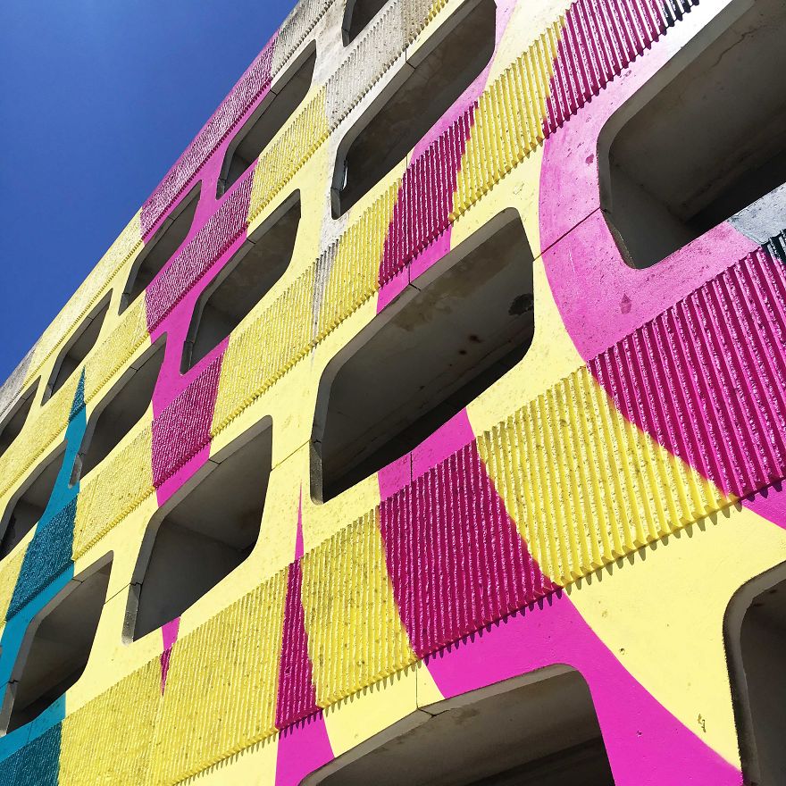 Street Artist Transforms 60s Carpark With Giant, Candy-Striped Supergraphic Artwork Street Artist Transforms 60s Carpark With Giant, Candy-Striped Supergraphic Artwork