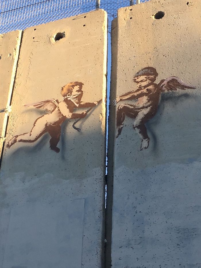 New Banksy Street Art In Palestine Reminds World That The Holidays Aren’t Happy For Everyone New Banksy Street Art In Palestine Reminds World That The Holidays Aren’t Happy For Everyone