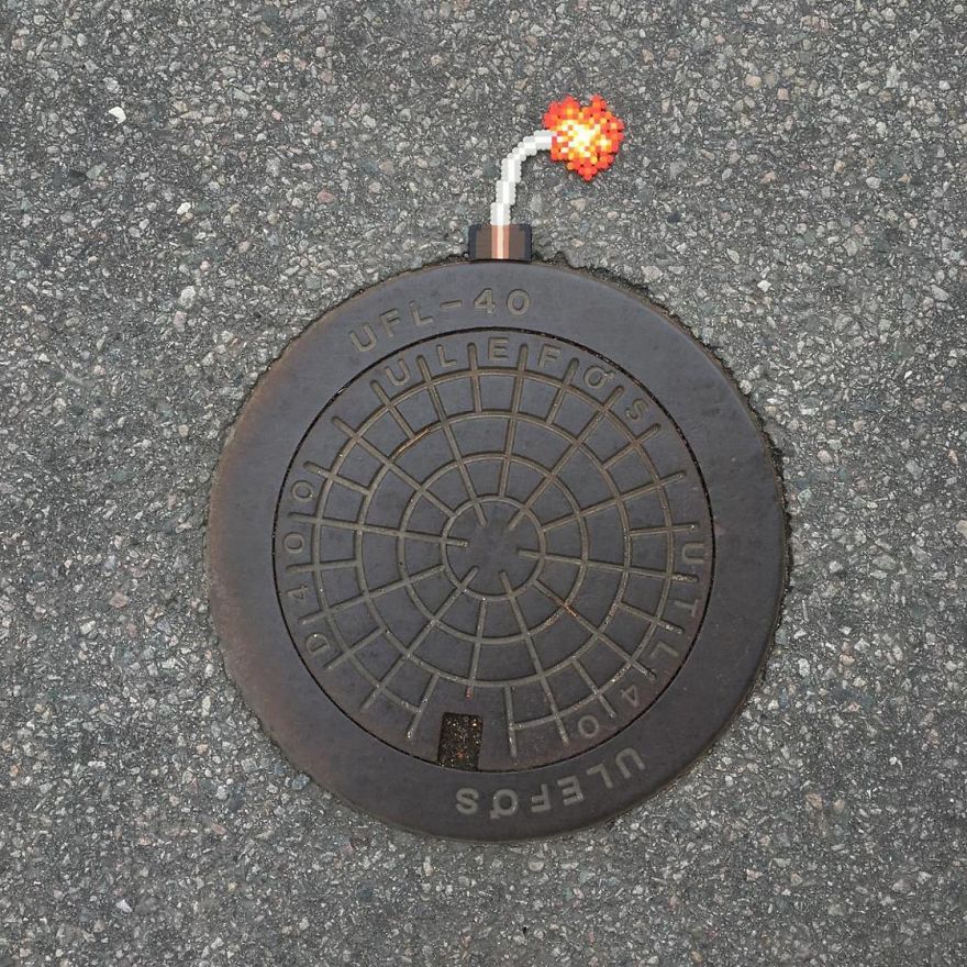 Someone Is ‘Vandalising’ Streets With Pixel Art, And The Result Is Awesome Someone Is ‘Vandalising’ Streets With Pixel Art, And The Result Is Awesome