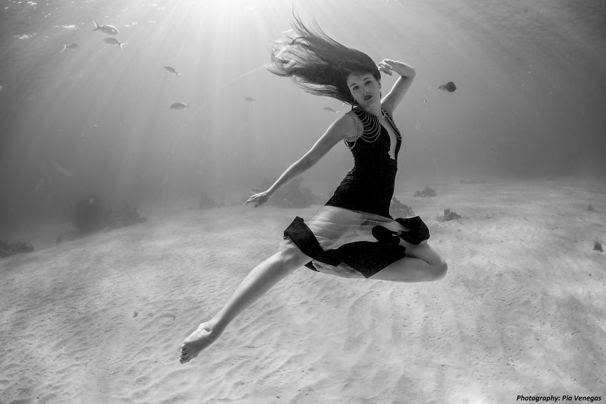 A Mermaid Swimming To Save Sharks