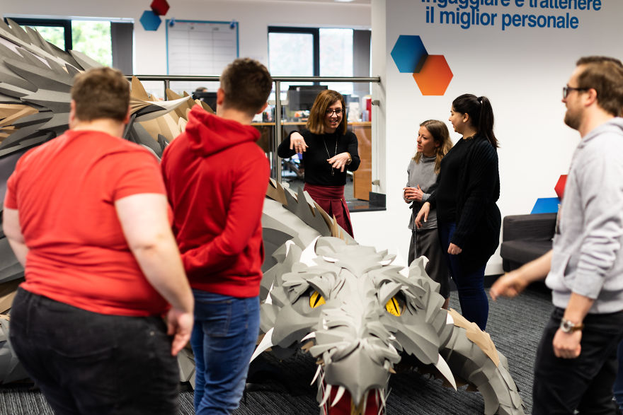 On Monday Morning, We Arrived At Work To Find A Fire-Breathing Dragon Built With 1200 Paper Sheets