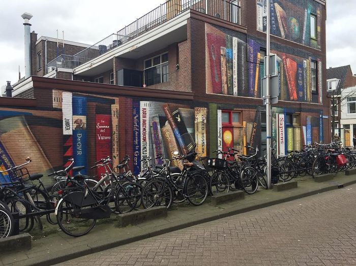 Dutch Artists Paint Giant Bookcase On An Apartment Building Featuring Residents&#8217; Favorite Books