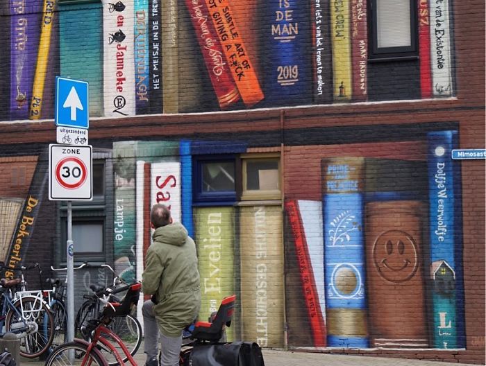 Dutch Artists Paint Giant Bookcase On An Apartment Building Featuring Residents&#8217; Favorite Books