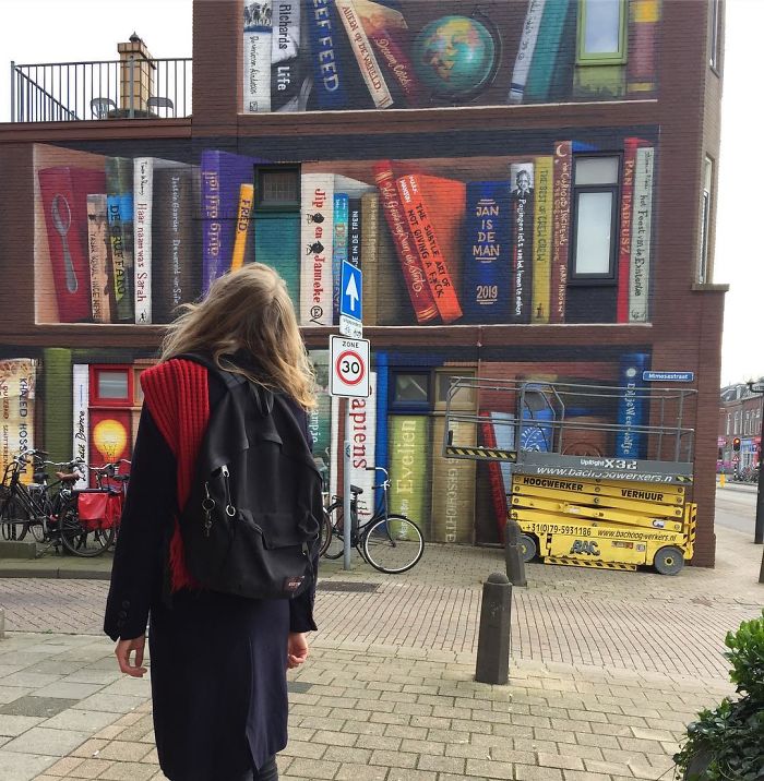 Dutch Artists Paint Giant Bookcase On An Apartment Building Featuring Residents&#8217; Favorite Books
