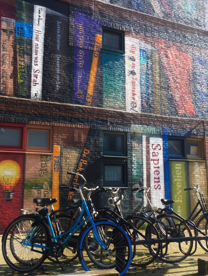Dutch Artists Paint Giant Bookcase On An Apartment Building Featuring Residents&#8217; Favorite Books