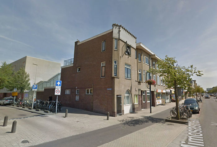 Dutch Artists Paint Giant Bookcase On An Apartment Building Featuring Residents&#8217; Favorite Books