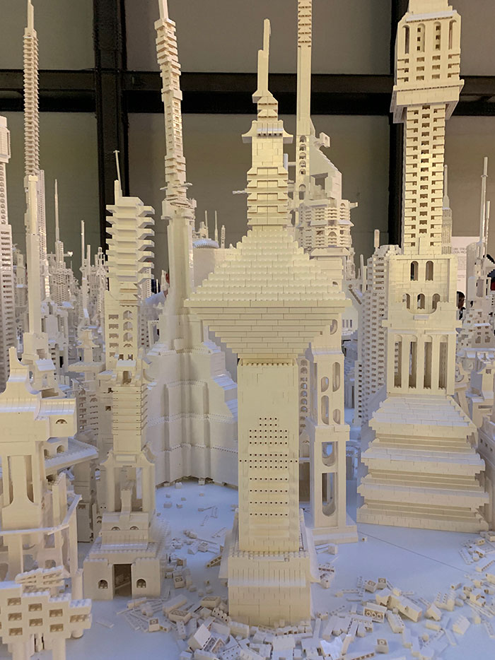 A City Is Being Built With White Lego Pieces And Everyone Can Join The Process