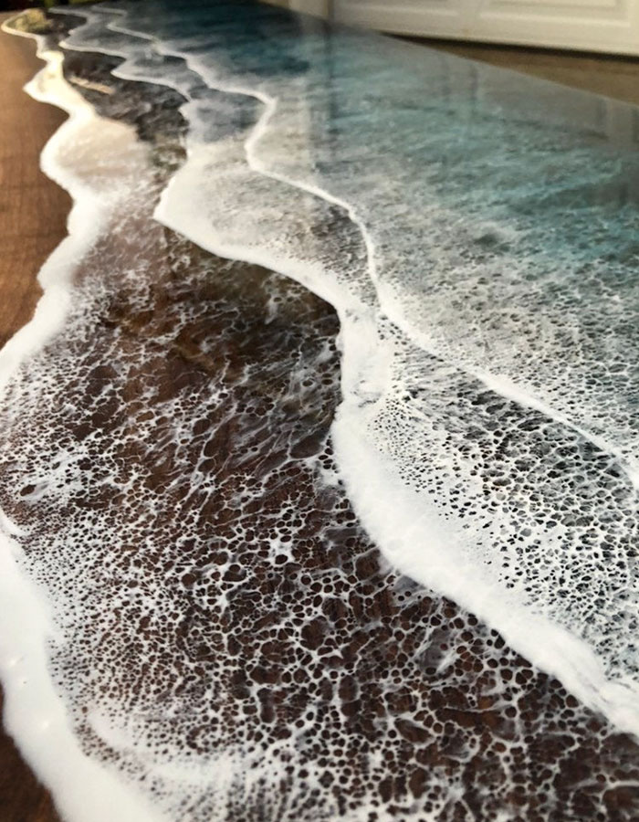 These Artists Create Mesmerizing Tables That Look Like They’re Being Washed By An Ocean Wave These Artists Create Mesmerizing Tables That Look Like They’re Being Washed By An Ocean Wave