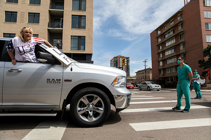 Medical Workers In Denver, Colorado Block Quarantine Protesters Medical Workers In Denver, Colorado Block Quarantine Protesters