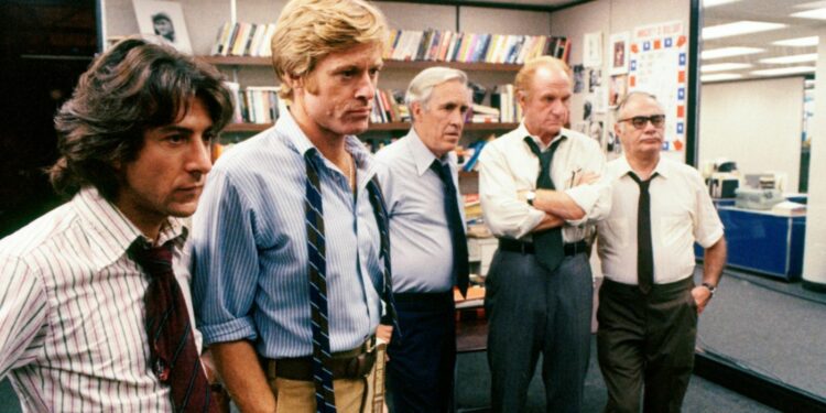 a group of actors posing in a film