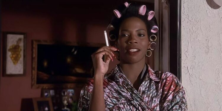 Tyra Ferrell holding cigarette