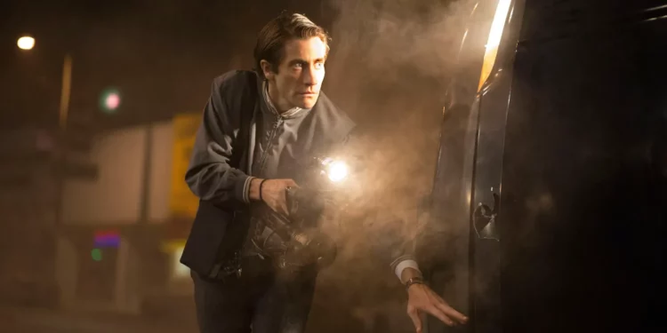 Jake Gyllenhaal with a flashlight posing for a movie shoot Jake Gyllenhaal with a flashlight posing for a movie shoot