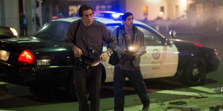 lou bloom with his assistant in front of police car lou bloom with his assistant in front of police car