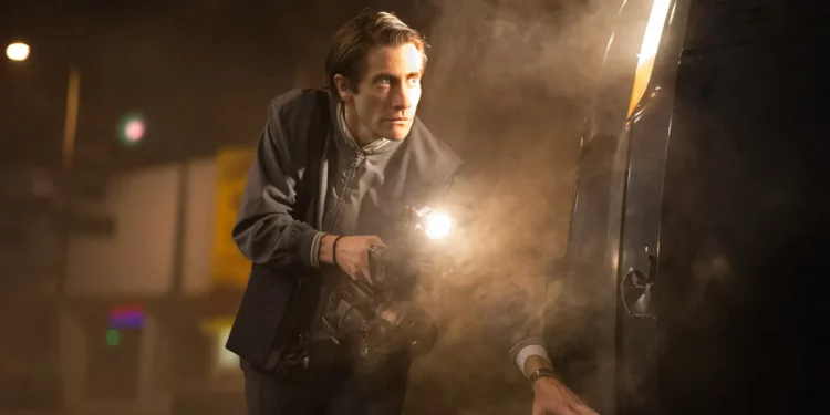 Jake Gyllenhaal with a bright torch 