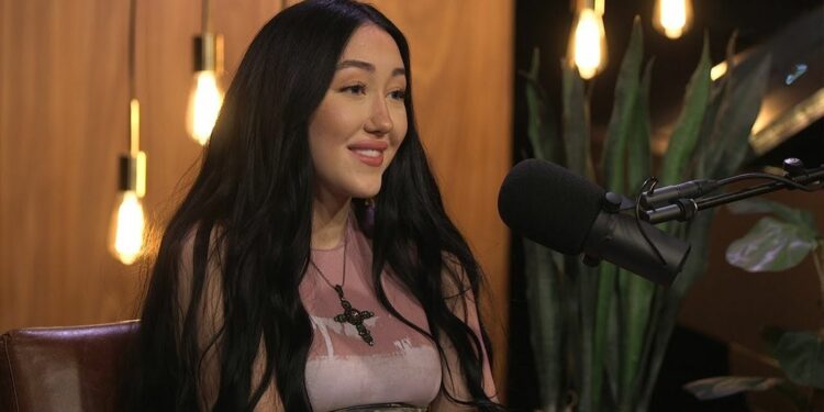 Noah Cyrus with a mic