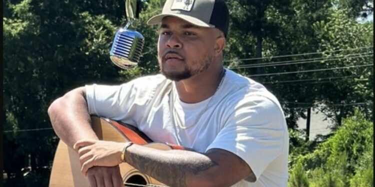 Suave Xavier with a guitar