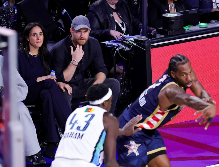 Prince Harry’s Body Language At NBA All-Star Game With Meghan Markle Sparks Theories