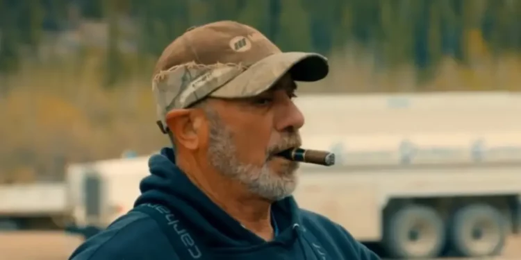 Chris Doumitt smoking a cigar