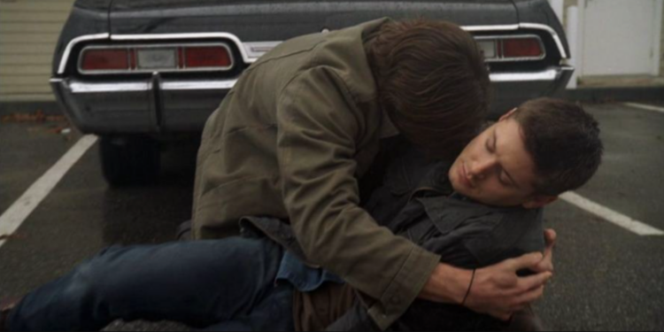  Sam Winchester holding his brother, Dean Winchester. 