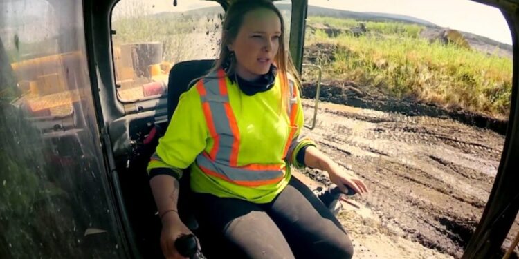 Monica Beets inside a crane