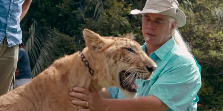 Bhagavan "Doc" Antle petting a big cat
