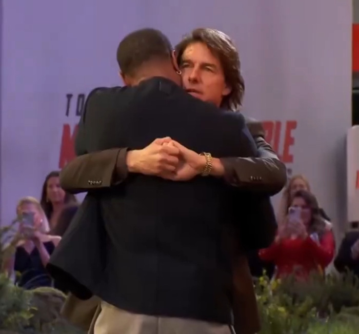 “Seems Terrifying”: Fans Spot Bizarre Detail In Photo Of Tom Cruise Hugging Michael B. Jordan