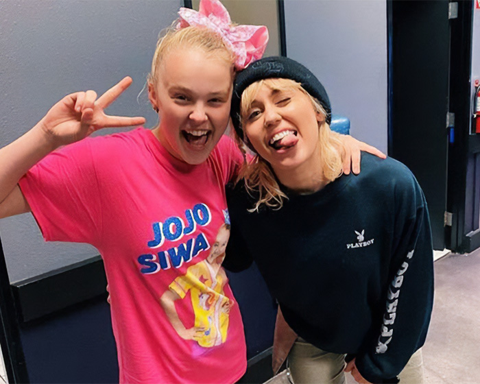 JoJo Siwa’s Look For ‘Hannah Montana’ Special Sparks Debate After Her “Trad Wife” Transformation