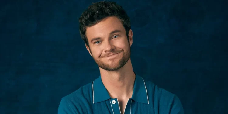 Jack Quaid blue background photo