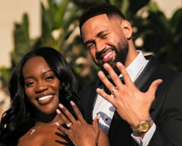 AD smith and Ollie showing off their wedding rings