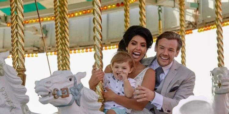 Cara De La Hoyde and Nathan Massey with their son
