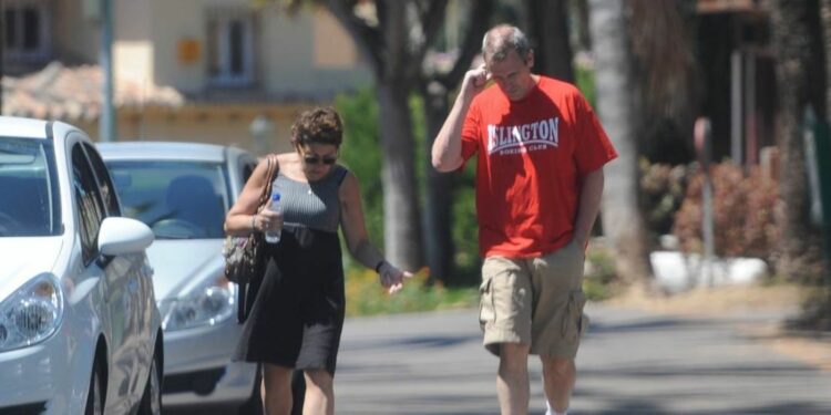 Actor Hugh Laurie walking with his wife Jo Green