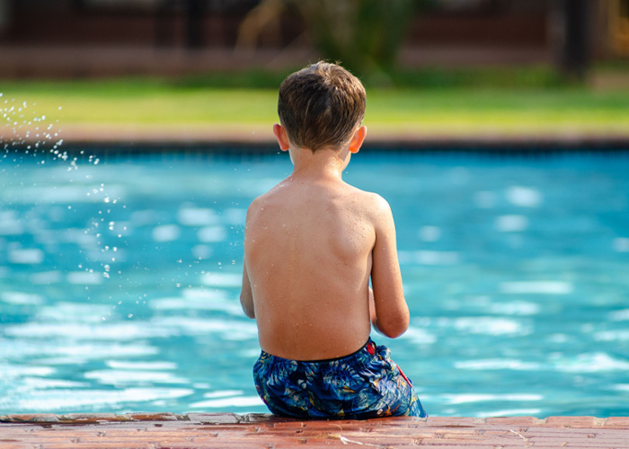 ‘Karen’ Kicked 7YO Child Into Hotel Swimming Pool In Chilling Footage, Claims “Bullying” Was Reason For Attack