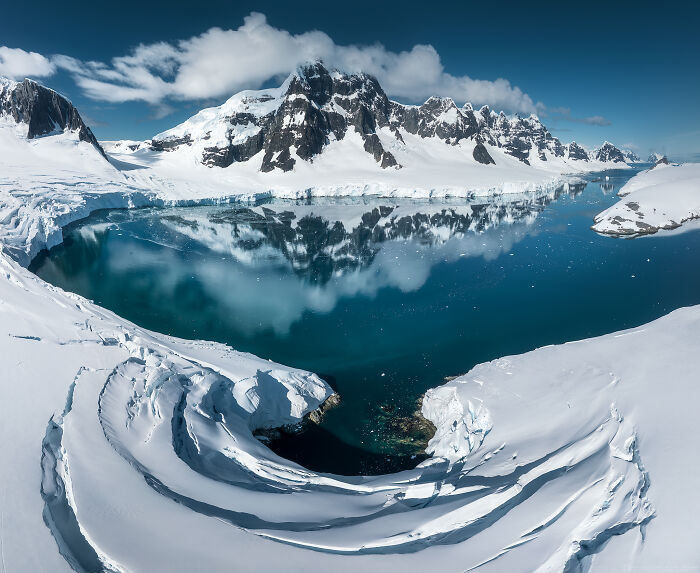 This Photographer Captured Antarctica’s Frozen Landscapes From A Red-Sailed Schooner (42 Pics) This Photographer Captured Antarctica’s Frozen Landscapes From A Red-Sailed Schooner (42 Pics)