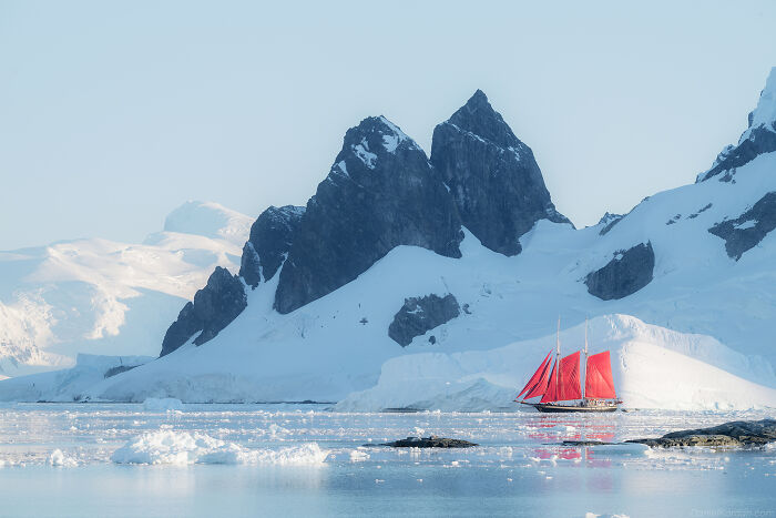 This Photographer Captured Antarctica’s Frozen Landscapes From A Red-Sailed Schooner (42 Pics) This Photographer Captured Antarctica’s Frozen Landscapes From A Red-Sailed Schooner (42 Pics)