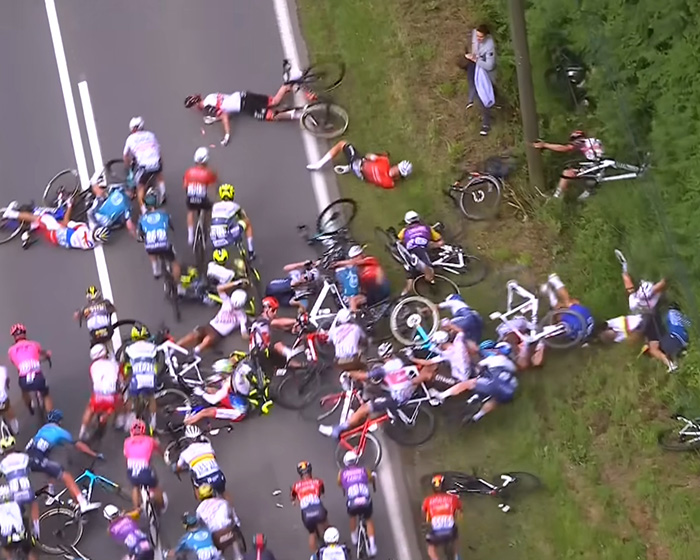 Bike Race Descends Into Chaos After Elderly Woman Charges Into Course On Mobility Scooter, Prompts Mass Crash