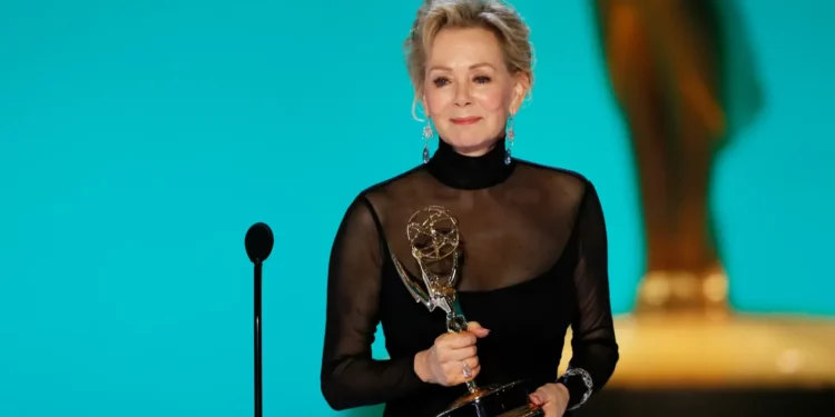 actress Jean Smart holding an Emmy award actress Jean Smart holding an Emmy award