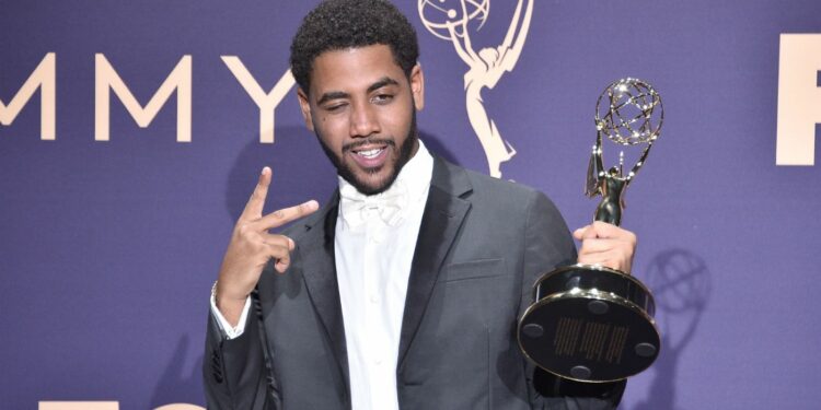 Jharrel Jerome posing with a celebratory Emmy award Jharrel Jerome posing with a celebratory Emmy award