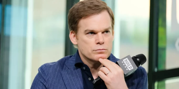 Michael C. Hall holding a mic