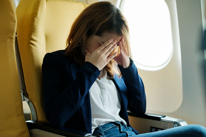 Woman Physically Stops Stranger From Reclining On An Overnight Flight, Throws A Tantrum Woman Physically Stops Stranger From Reclining On An Overnight Flight, Throws A Tantrum